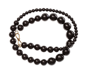 coiled necklace from polised jet stone isolated