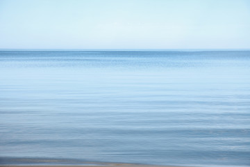 Flat surface of the sea, calm. Blue sky, Baltic, day.