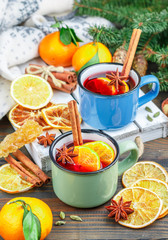 Mulled wine. Traditional hot winter alcoholic or non-alcoholic drink of red wine, citrus fruits (orange or Mandarin) with cinnamon, honey, cardamom, ginger and star anise. Punch. Grog. Christmas