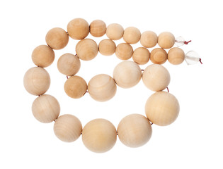coiled string of wooden beads isolated