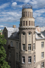 Fototapeta na wymiar Beautiful corner of a residential building, round tower. View from the top. Art Nouveau, Riga, Latvia.