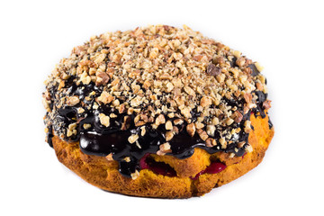 Sponge cake with nuts isolated on white. Close-up. Homemade baking.