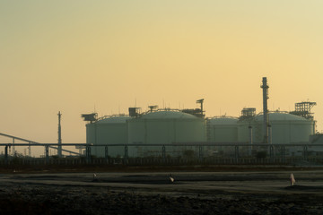 Fototapeta na wymiar LNG storage tank used for the storage of Liquefied Natural Gas in petro chemical industrial