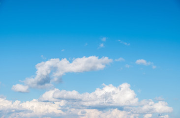 Naklejka na ściany i meble Fluffy cloud on the clear blue sky with the copy space.