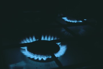 burning burner. natural gas. stove in the kitchen. flame, fire close-up. energy saving concept