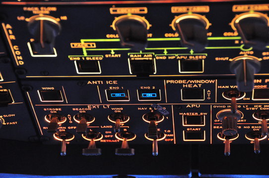 Overhead panel view of an Airbus A320, with lights switches and inoperative push button