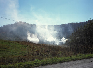 Fototapeta na wymiar Burning charcoal, Bieszczady Mountains, Carpathians Mountains, Poland
