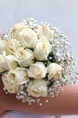 Beautiful wedding bouquet in hands of the bride