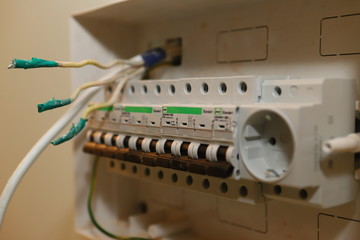  Master Electric installs and connects electrical equipment. Close up. Shallow depth of field.