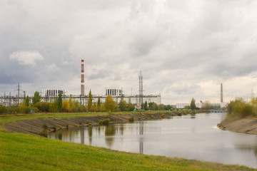 Fototapeta na wymiar Industrial plants and river in Chernobyl, Ukraine