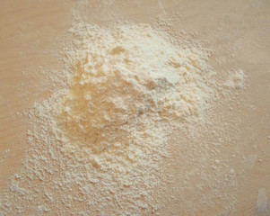 white flour on wooden table, top view ,free space