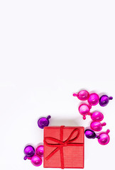 Red gift box on a white background. Red ribbon. Valentine's day gift. Christmas. Isolated. Top view with place for text.
