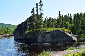 "Steam boat" rock formation in the middle of a Canadian river, near Lake Dunbar near the Parc national de la Mauricie