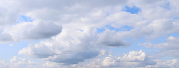 Summer sky and clouds. Panoramic photo, August, rainy season, atmospheric phenomena.