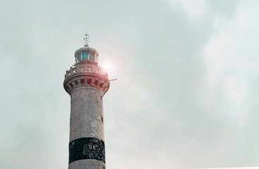 old lighthouse against the blue sky