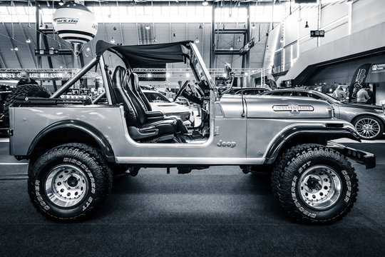 STUTTGART, GERMANY - MARCH 03, 2017: Compact sport utility vehicle Jeep CJ7, 1980. Black and white. Europe's greatest classic car exhibition "RETRO CLASSICS"