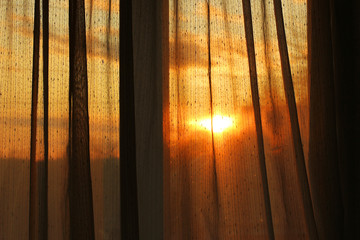 The sun in the window. Sunset. Abstract photo.