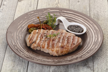 Grilled pork steak with pepper sauce