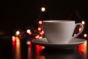 Food, white cup of tea and saucer, lighting lights