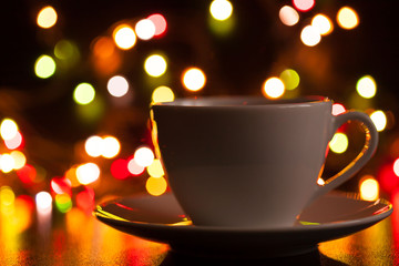 Food, white cup of tea and saucer, lighting lights