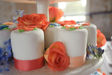 wedding dessert with orange roses