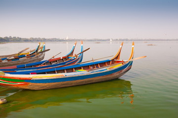 Fototapeta premium Myanmar. Landscape. Boats in lake. Trash