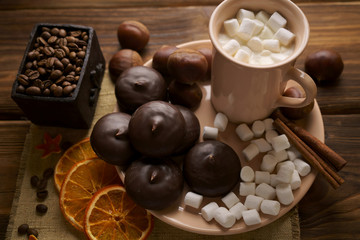 Marshmallows in chocolate icing and coffee with marshmallows