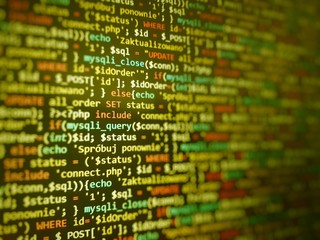 Yellow unique background. Programming PHP on laptop computer screen. Program code PHP HTML CSS of...