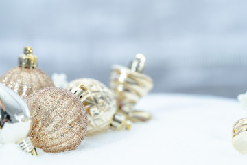 Christmas of  winter - Christmas balls with ribbon on snow, Winter holidays concept. Christmas red balls, golden balls, pine And Snowflakes decorations In Snow Background