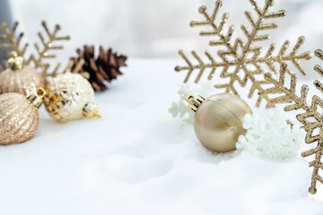 Fototapeta na wymiar Christmas of winter - Christmas Snowflakes on snow, Winter holidays concept. White and Golden Snowflakes decorations In Snow Background
