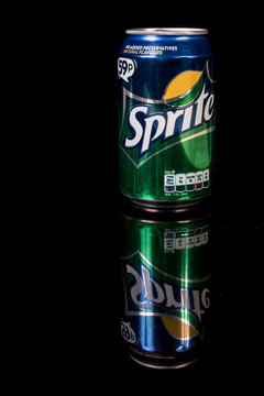 A can of Sprite isolated on a black background