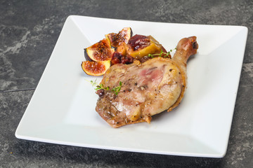 Roasted. duck. leg with plum and apple