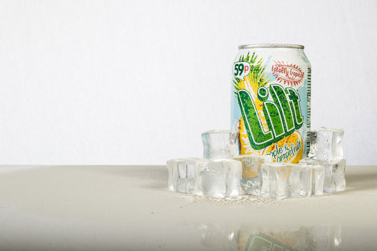 A can of chilled Lilt with ice against a white background
