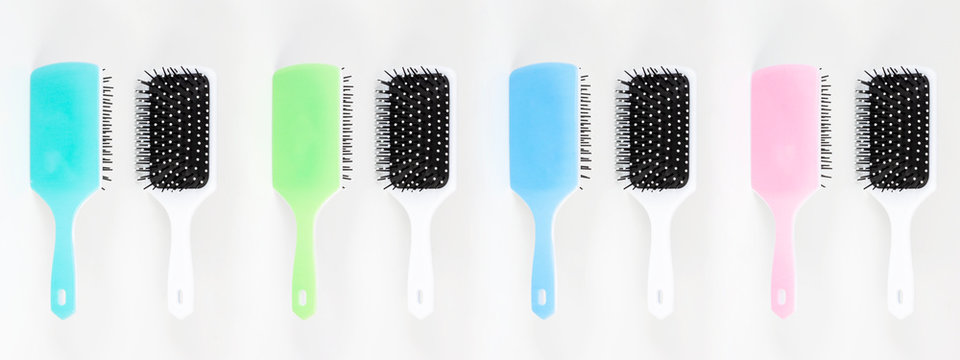 Beautiful trendy Big set of plastic hair brushes different color isolated on white background front and back view