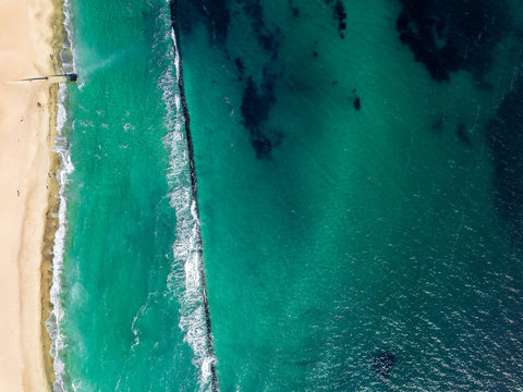 Aerial top view from drone to a marine scape. Sea wave above bre