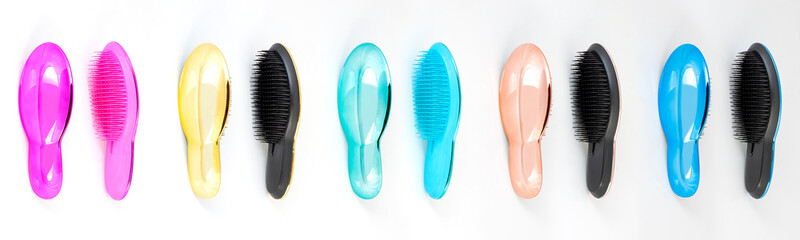 Beautiful trendy Big set of plastic hair brushes different color isolated on white background front and back view
