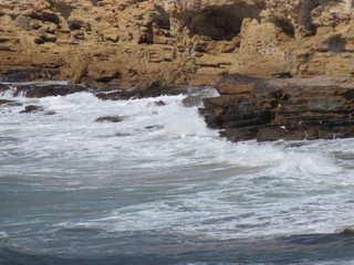 Rocky sea shore with waves