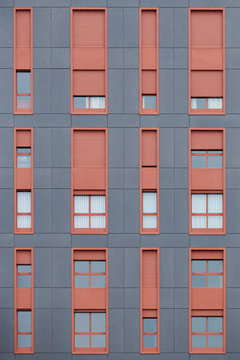 Gray facade with colorful windows