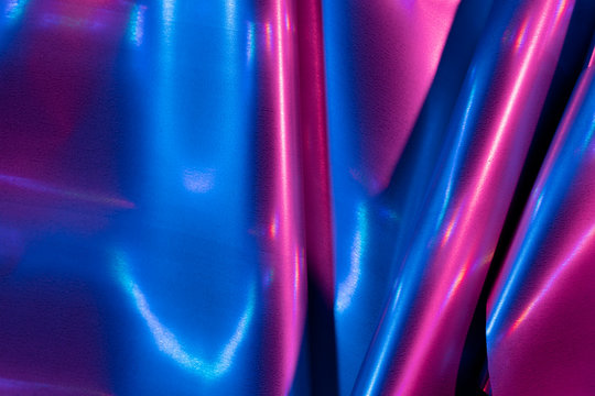 Reflection of light on holographic foils with neon lighting