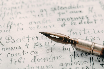 Fountain pen on an ancient handwritten letter. Old story. Retro style.