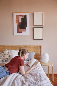 Vertical view of a lady reading a book.