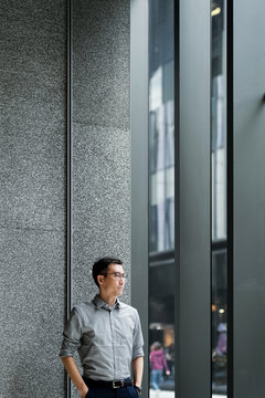 Businessman standing by the window