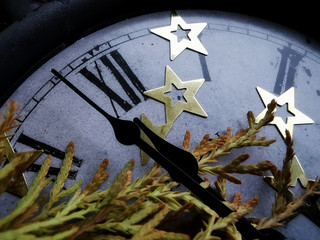 New Year is coming. Vintage clock and Christmas decorations.