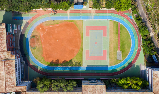 Sports venue and playground of elementary school, aerial view.