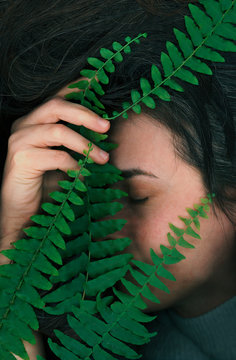 Digital Scan Of A Woman Hided By Fern Leaves