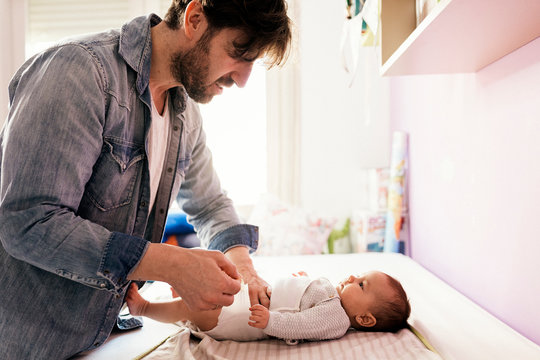 Proud Father Changing Nappy