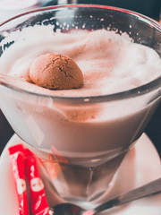 Cookie in the cup of coffee latte