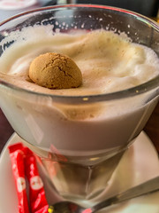 Cookie in the cup of coffee latte