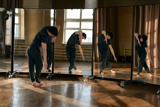 Expressive dancer against mirrors in studio