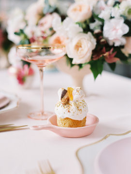 Small delicious cupcakes on table